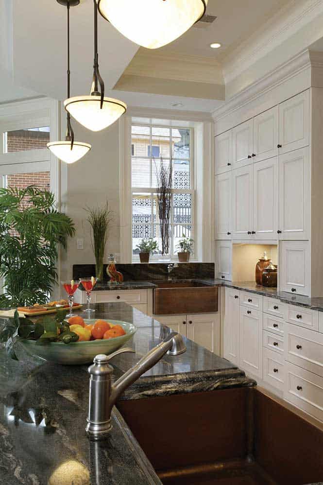 White recessed panel cabinets offer ample, beautiful storage.