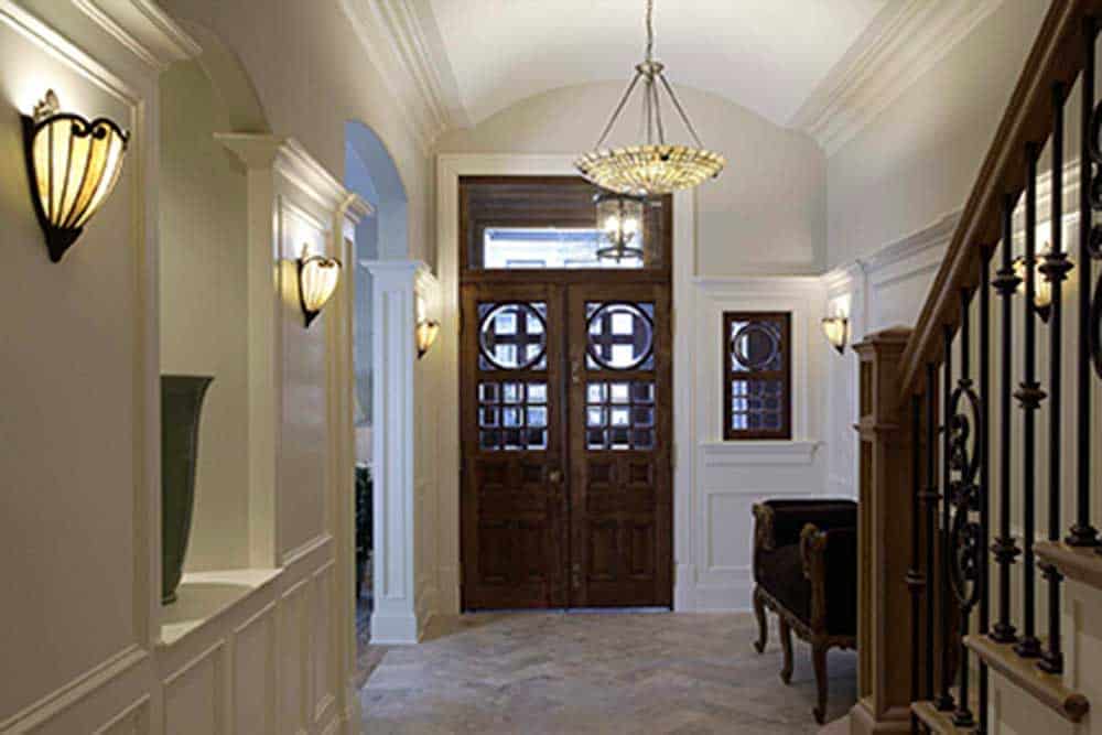 The barrel vault ceiling makes the foyer feel larger and more welcoming.