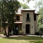 Stucco Home with Arched Doorways and Windows