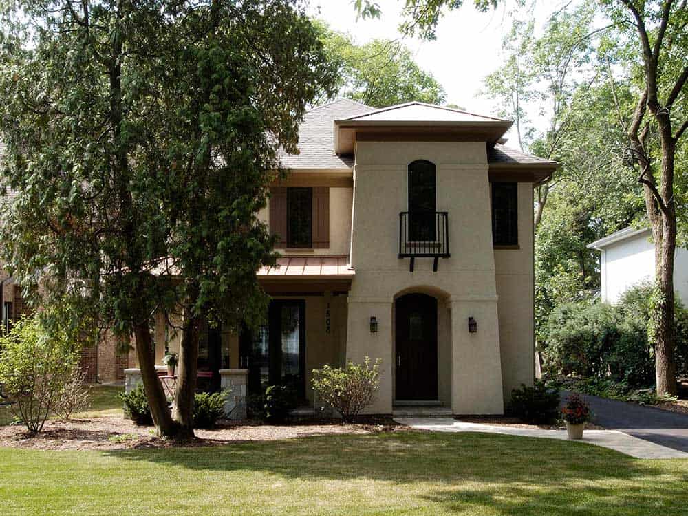 Stucco Home with Arched Doorways and Windows