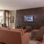 Dramatic stone wall surrounding the fireplace in Deerfield, IL livingroom