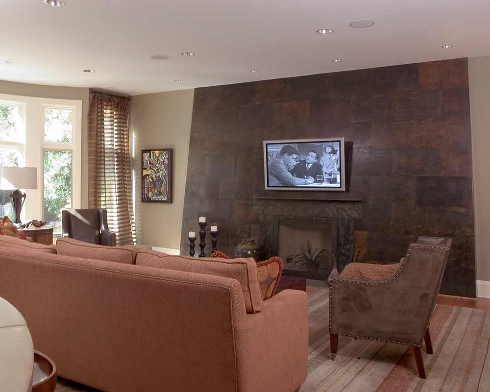 Dramatic stone wall surrounding the fireplace in Deerfield, IL livingroom