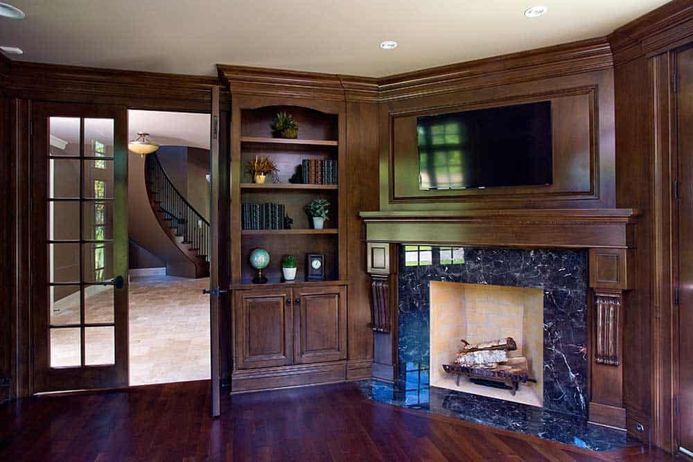 Study includes a Wood Burning Fireplace & Built-In Shelving