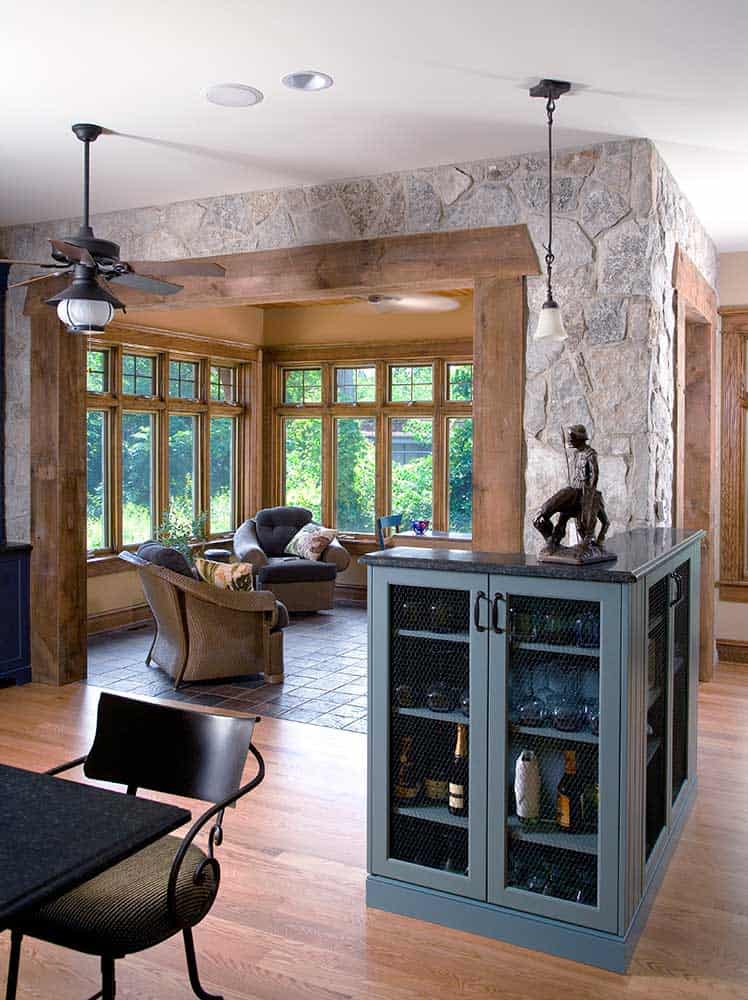 The stone and timbers in the home’s sunroom bring the outdoors in.