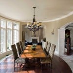 The Dining Room has Wooden In-laid flooring and Multiple overlooking Full-Height Windows