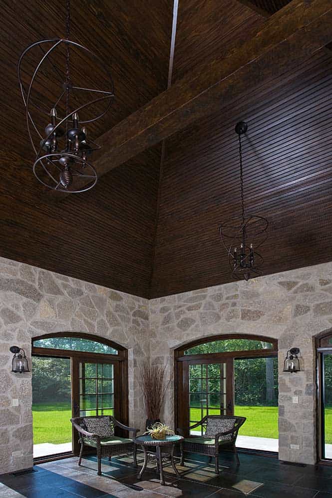 Breathtaking Dark Wood Paneled Ceiling with Wrought Iron Chandeliers