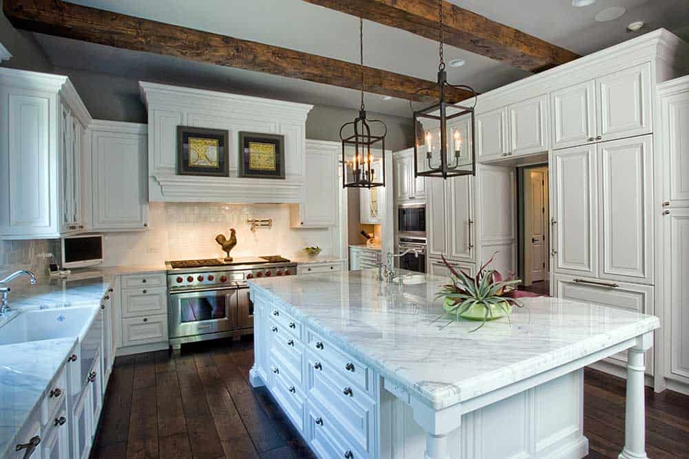 Kitchen with White Marble Countertops, Wood Plank Flooring & Wooden Beams