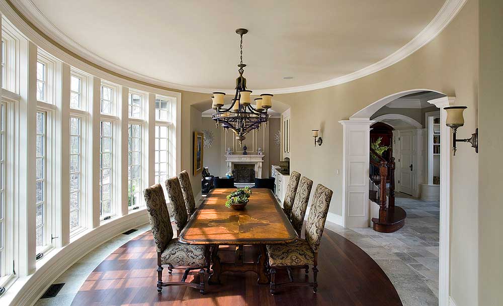The Dining Room has Wooden In-laid flooring and Multiple overlooking Full-Height Windows