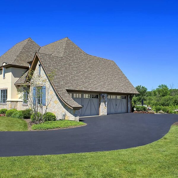 asphalt driveway with two car garage