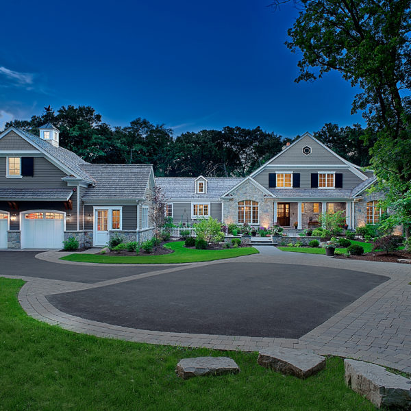 front entry driveway with paver banding Twilight shot of entry driveway