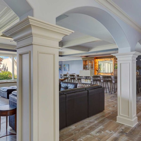 paneled-columns-connect-arched-openings-lower-level-family-room paneled-columns-connect-arched-openings-lower-level-family-room