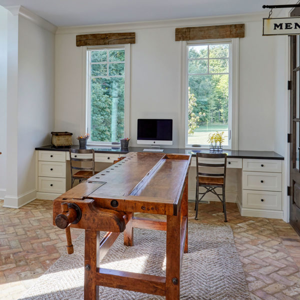 home-office-built-in-desks-brick-floors-antique-workbench
