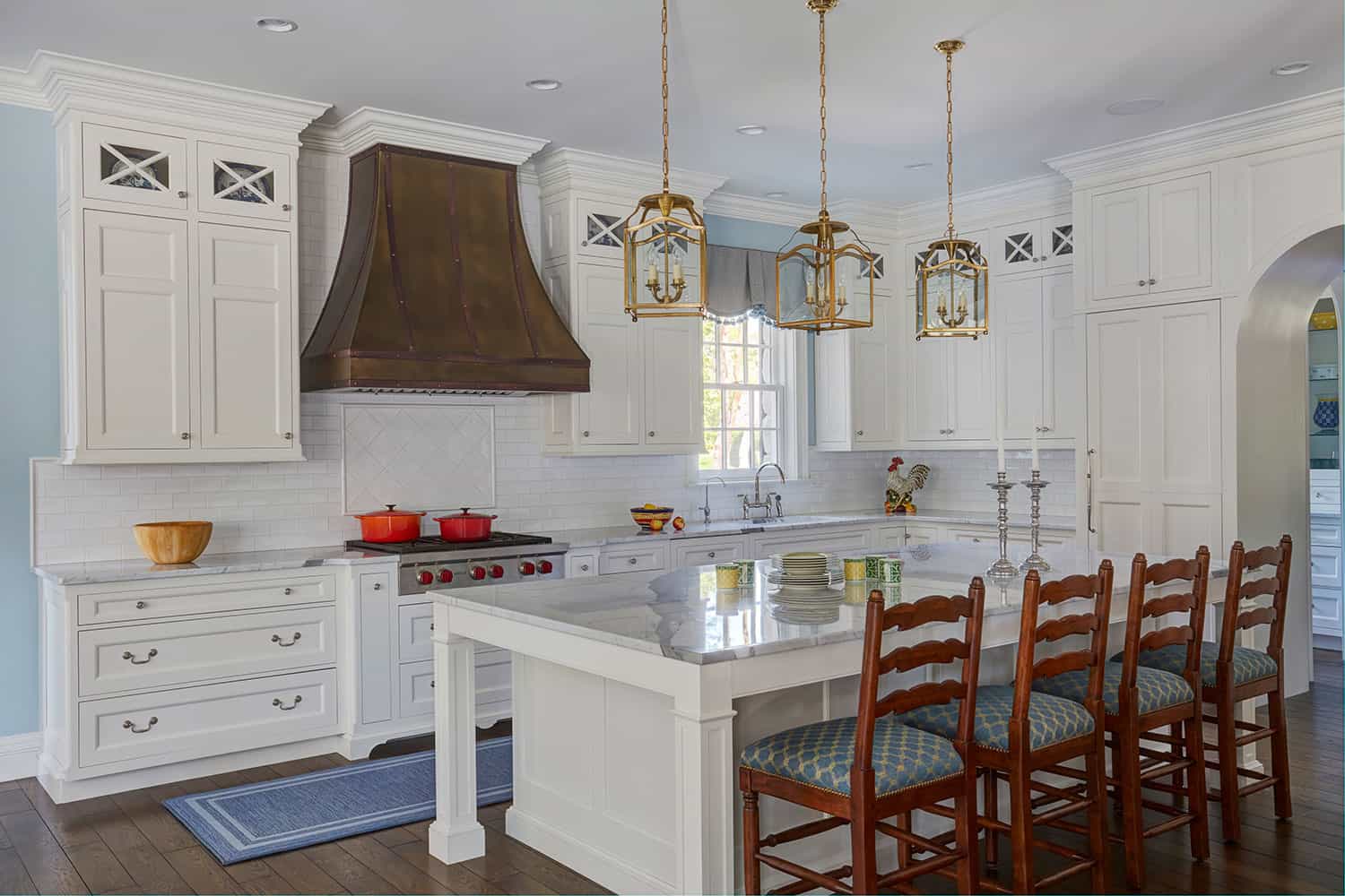 large-island-topped-in-marble-traditional-white-painted-cabinetry