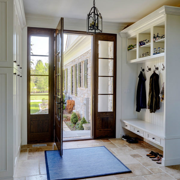 mudroom-entry-travertine-flooring-built-in-cabinetry-bench-seating mudroom-entry-travertine-flooring-built-in-cabinetry-bench-seating