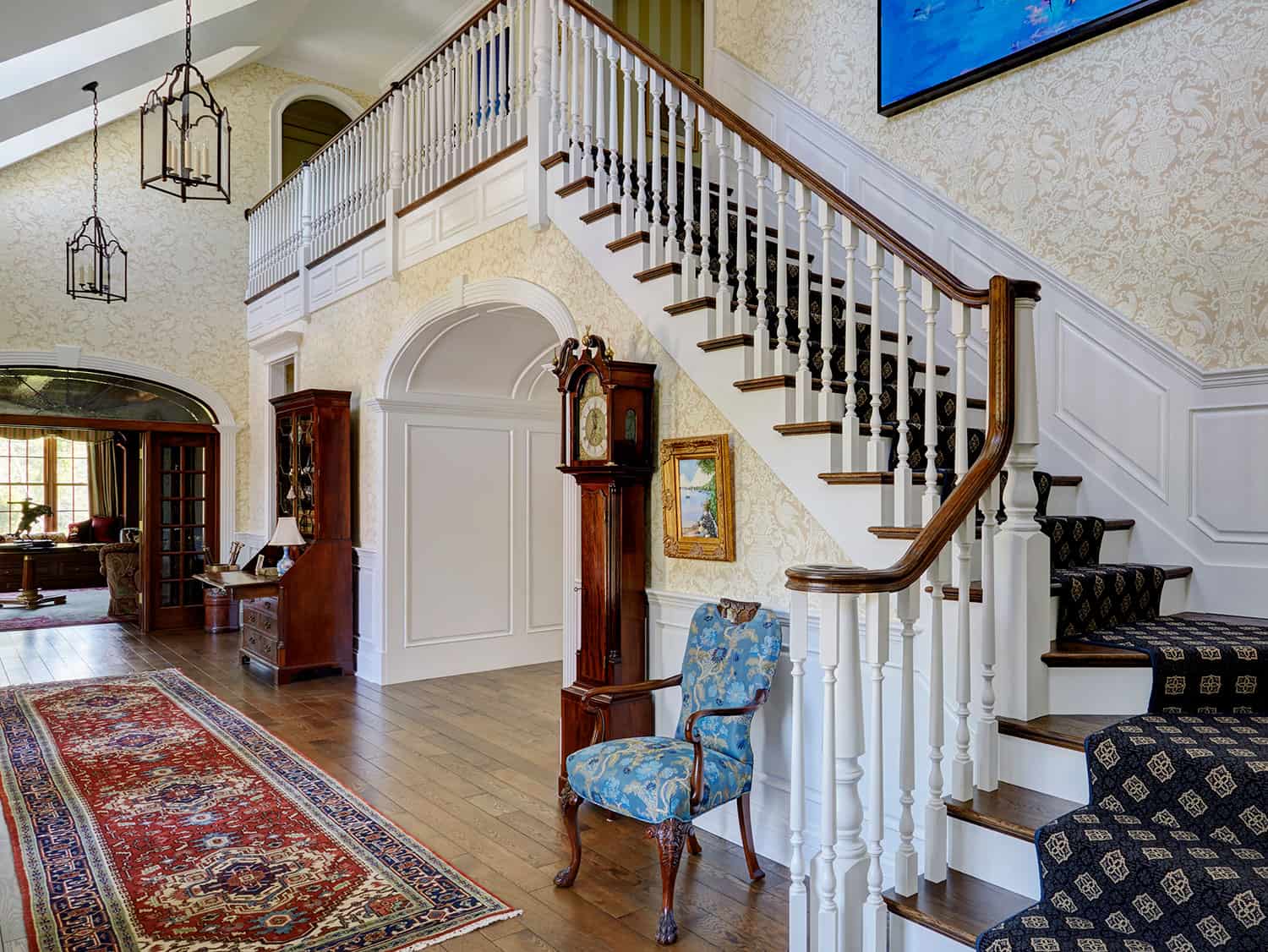 staircase-features-dark-stained-wood-treads-white-painted-balusters