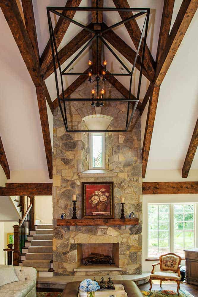 two-story-stone-fireplace-rustic-beamed-ceiling