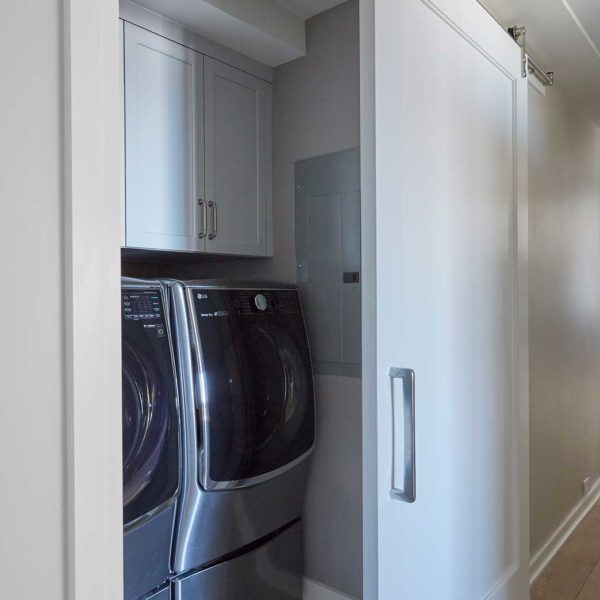 barn-door-conceals-laundry-closet
