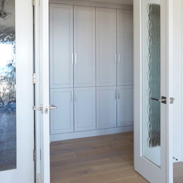 french-doors-with-decorative-glass-white-hallway-cabinets