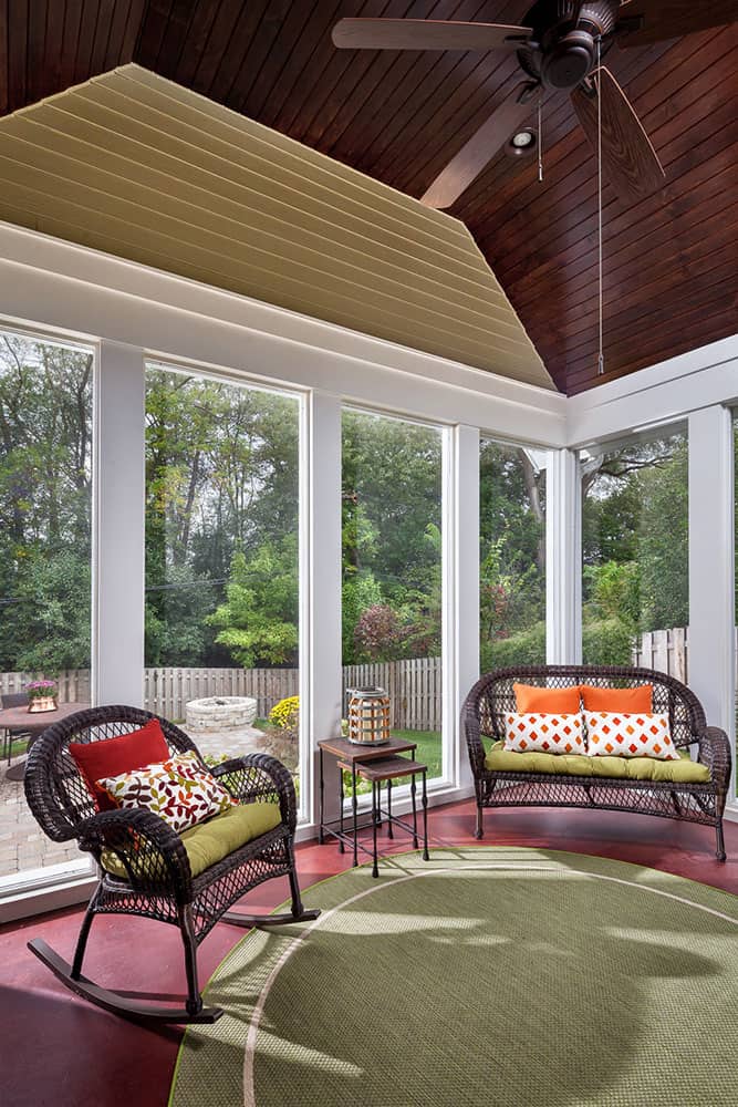 sunroom with tongue and groove wood ceiling and full to ceiling windows