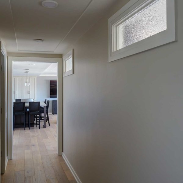 interior-transom-window-brings-light-to-hallway