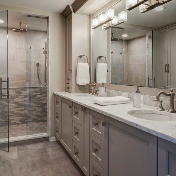 master-bath-with-gray-cabinetry-his-and-her-sinks