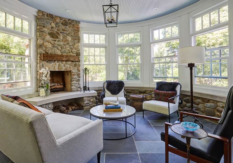sunroom-with-stone-fireplace-beadboard-ceiling-stone-floor round sunroom addition with fireplace