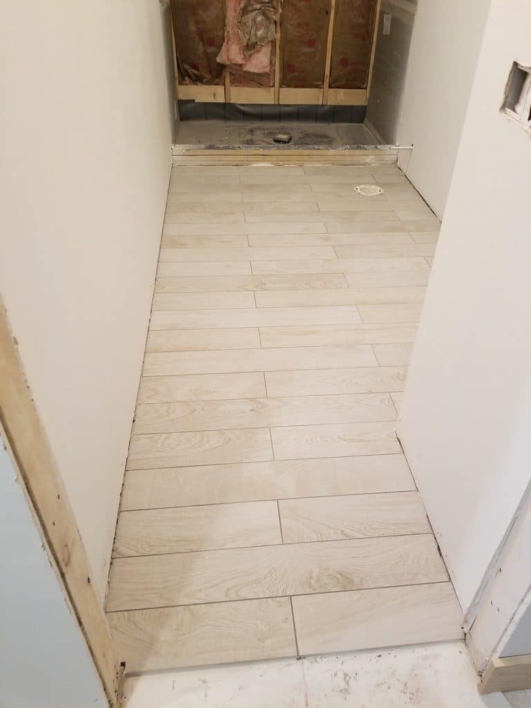 tile flooring being installed