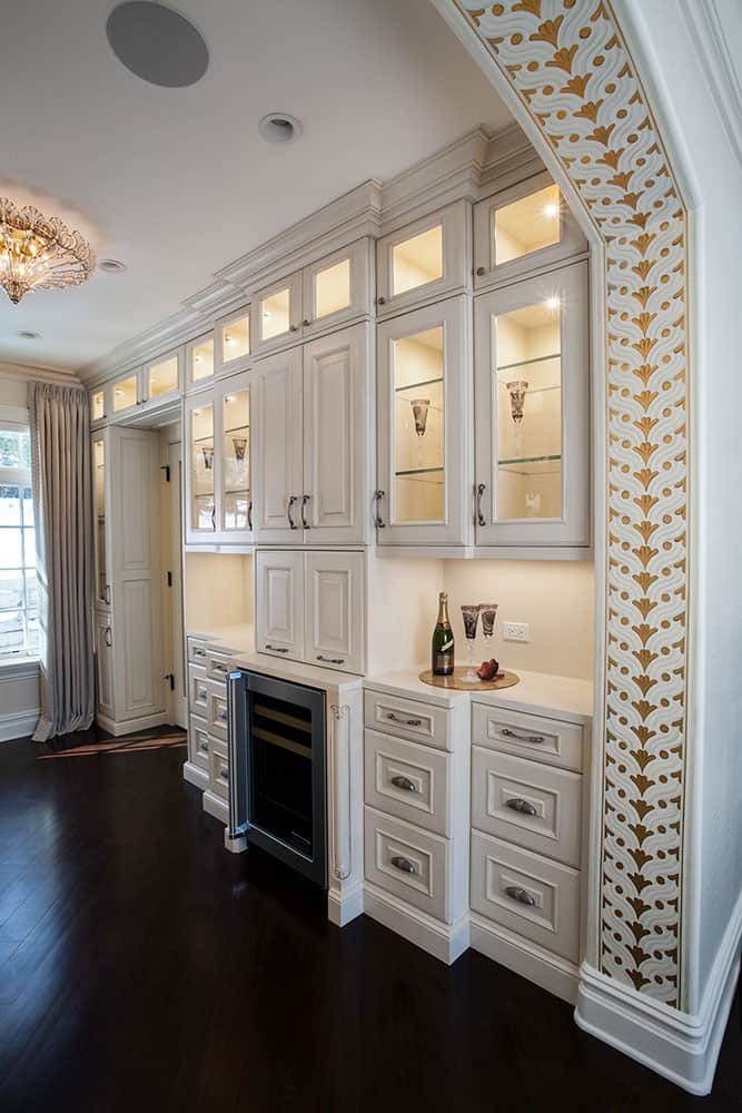 beverage center built into master closet cabinetry