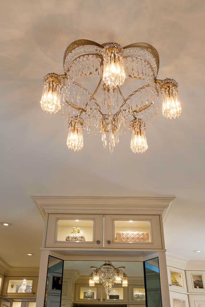 gold chandelier in master closet with crystals