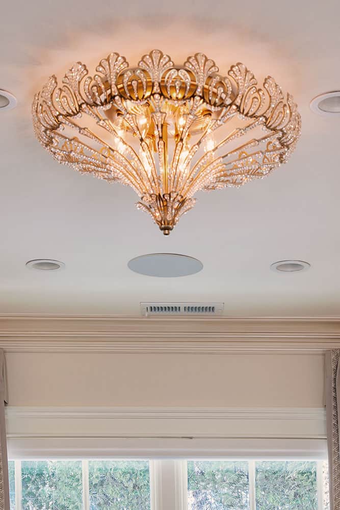 gold and crystal semi flush chandelier with open metalwork and crystal details