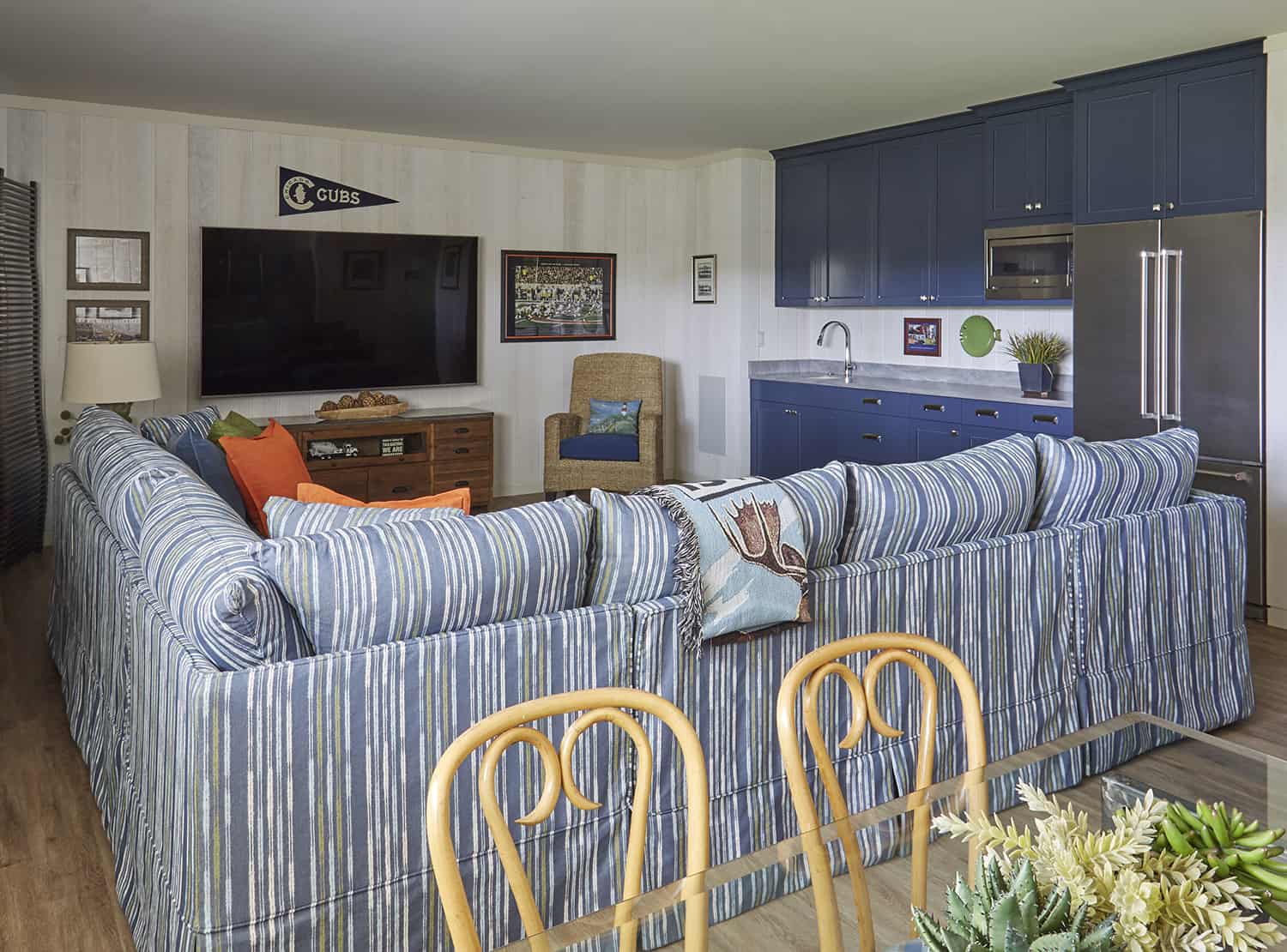 striped blue sectional sofa in lower level family room