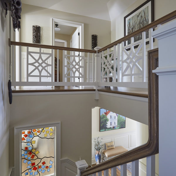 custom-baluster-millwork-with-interior-art-glass-window intricate baluster detail