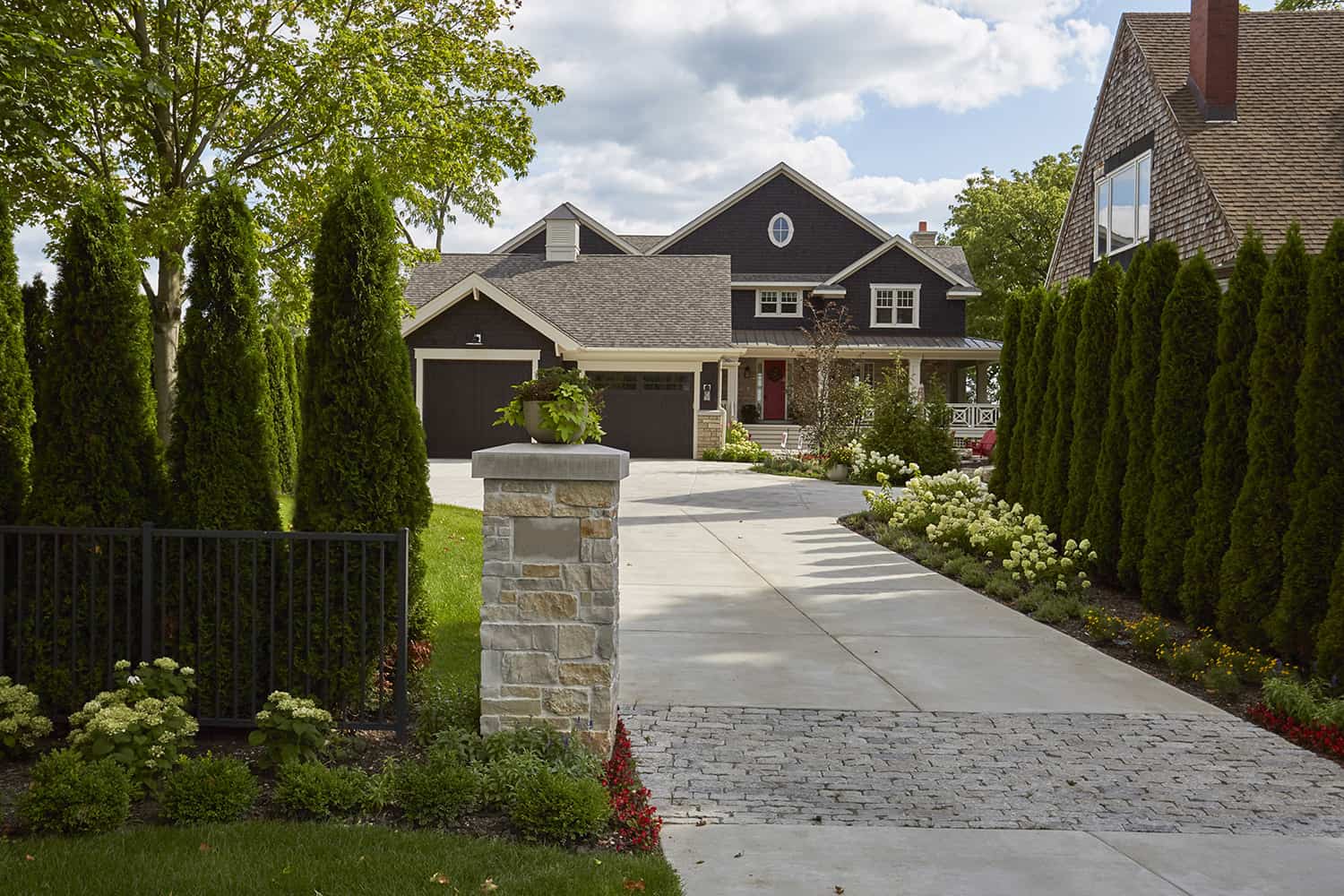 driveway with stone entry pillar