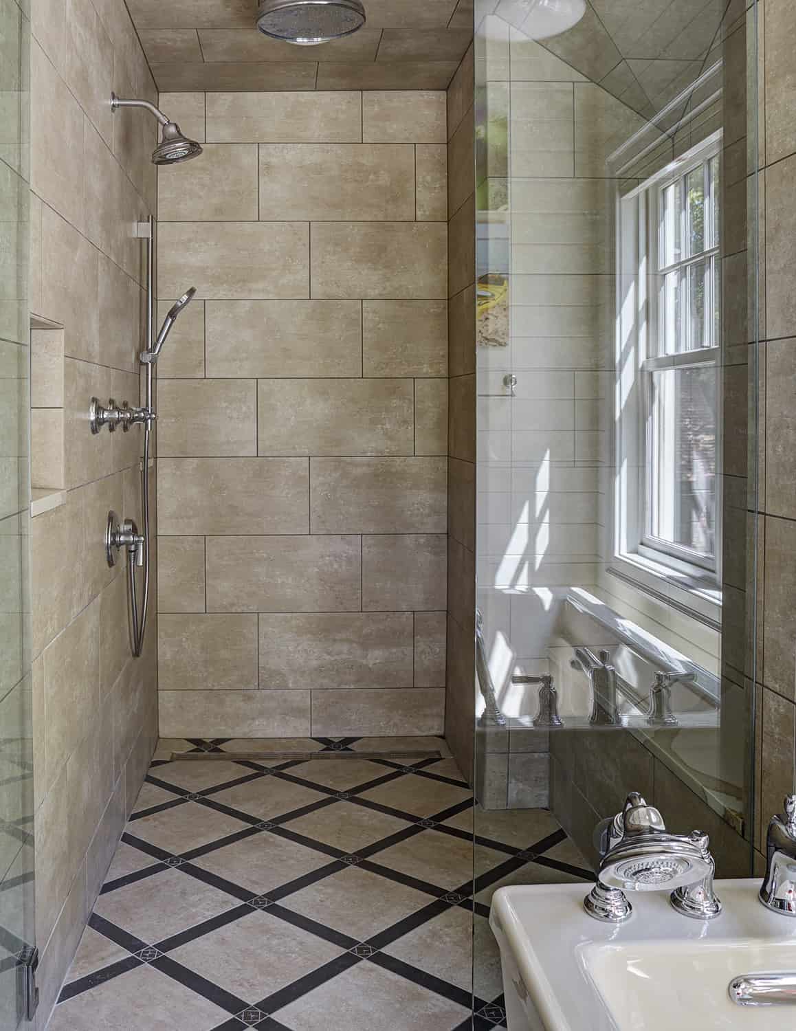 master shower with stone flooring