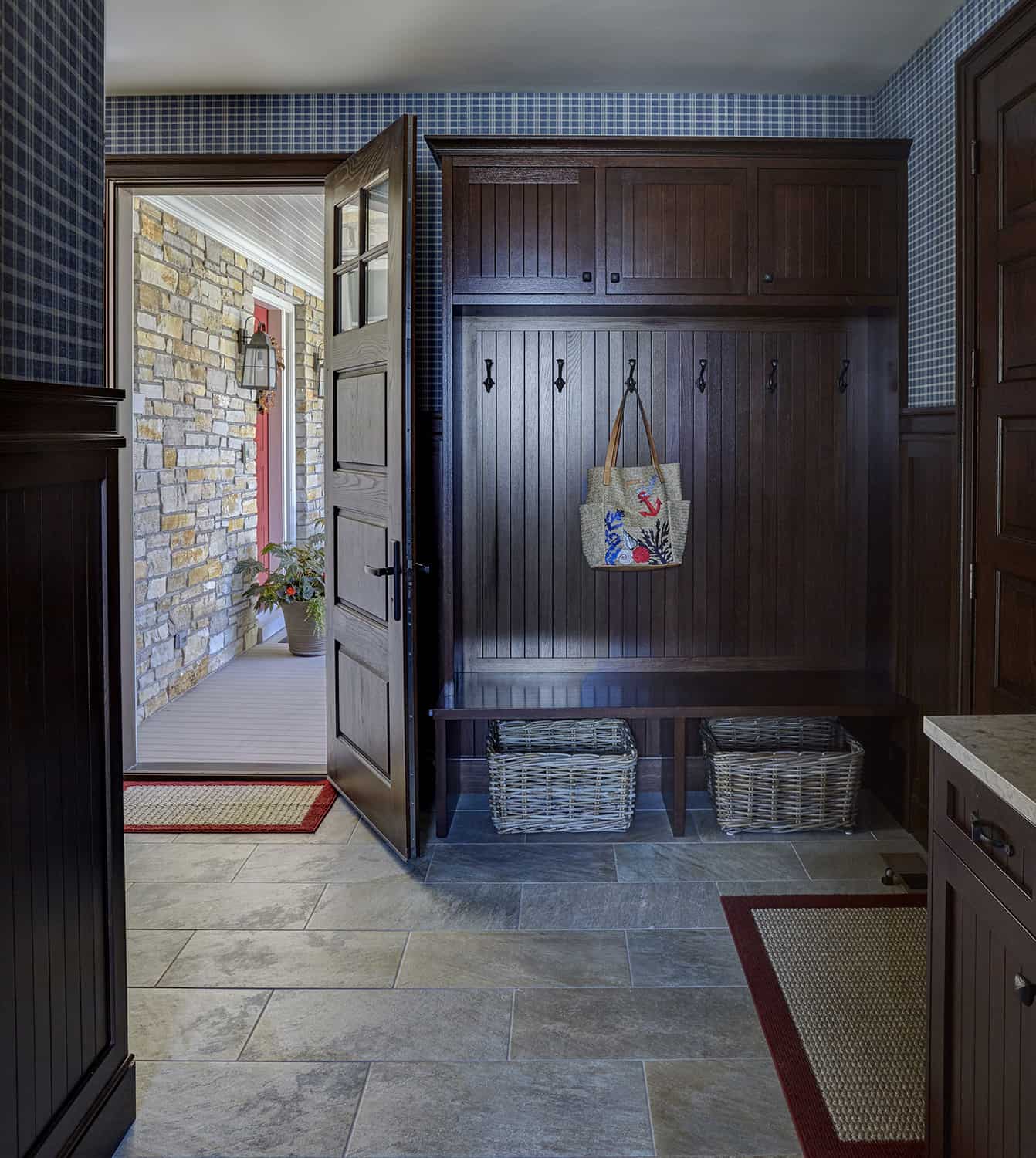 mudroom with ark wood cabinetry