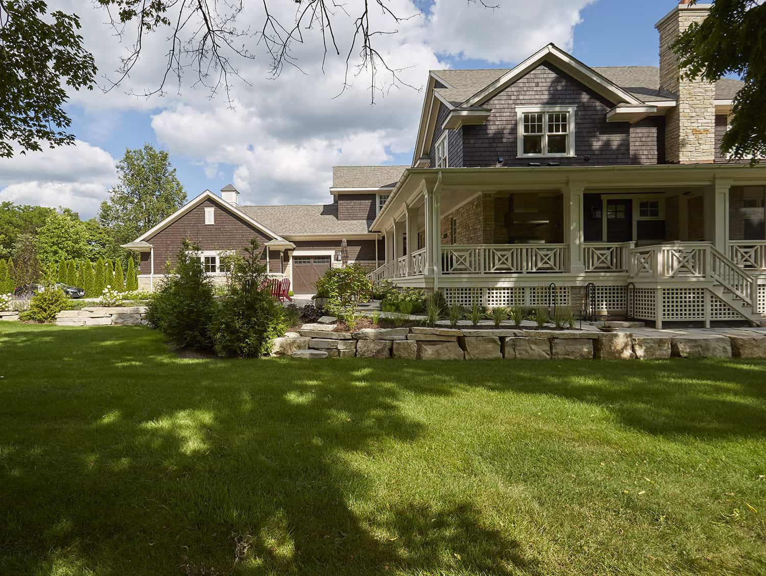 side elevation with outcropping stone retaining wall