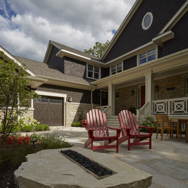 patio-with-natural-stone-firepit firepit made from large stone boulder