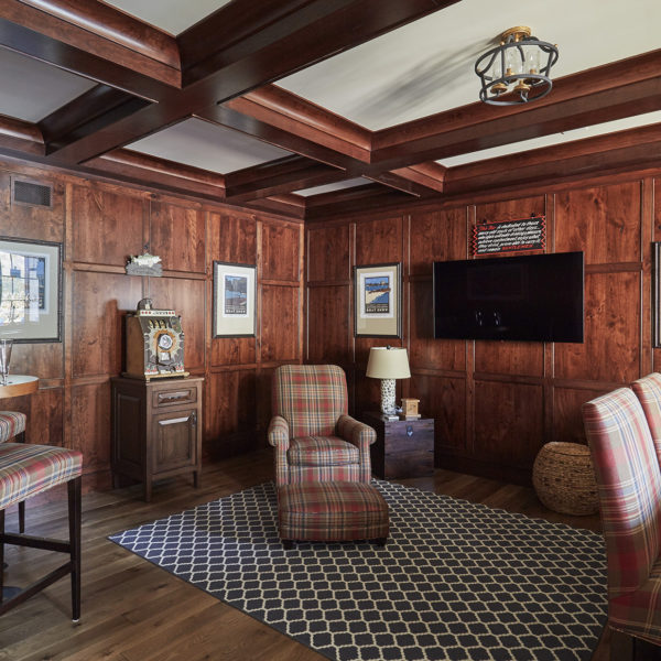 rich-wood-paneling-ceiling-beams-home-bar paneled walls and beam ceiling in home bar
