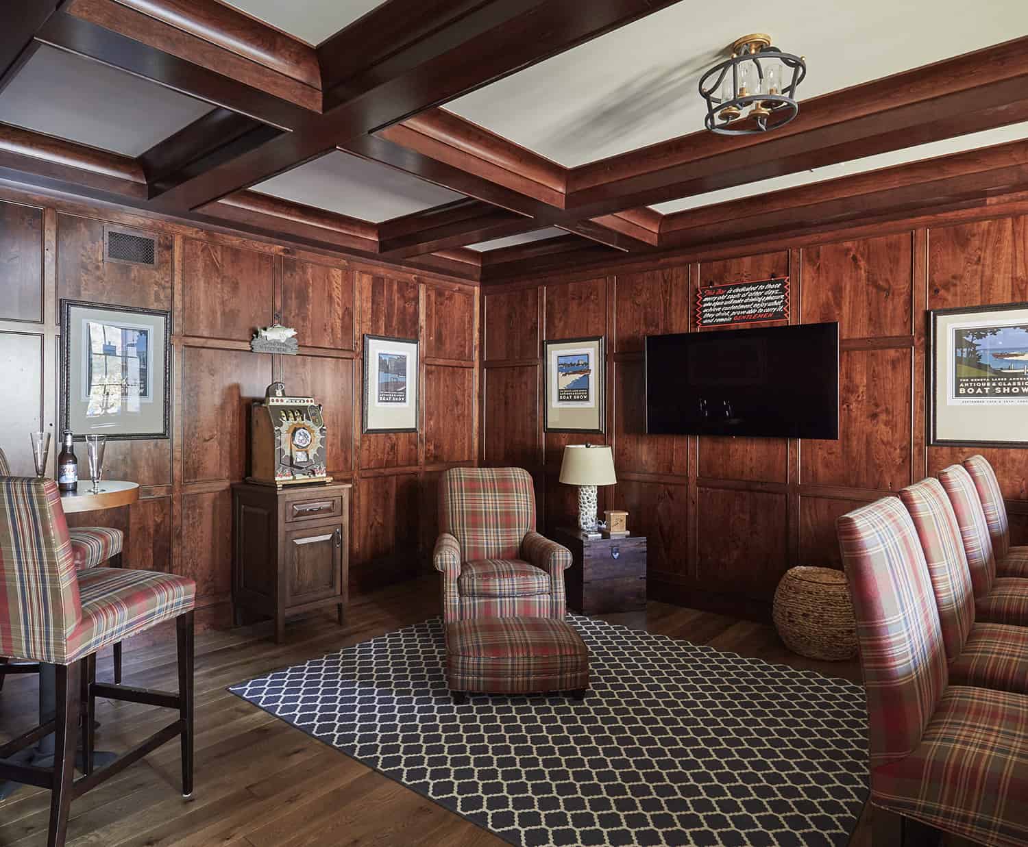 paneled walls and beam ceiling in home bar