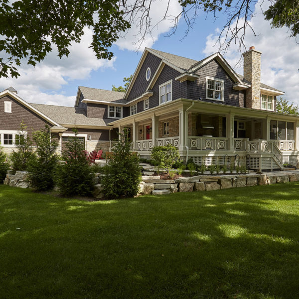 side-elevation-with-stone-outcropping-retainer-wall side elevation of lakefront lake geneva residence