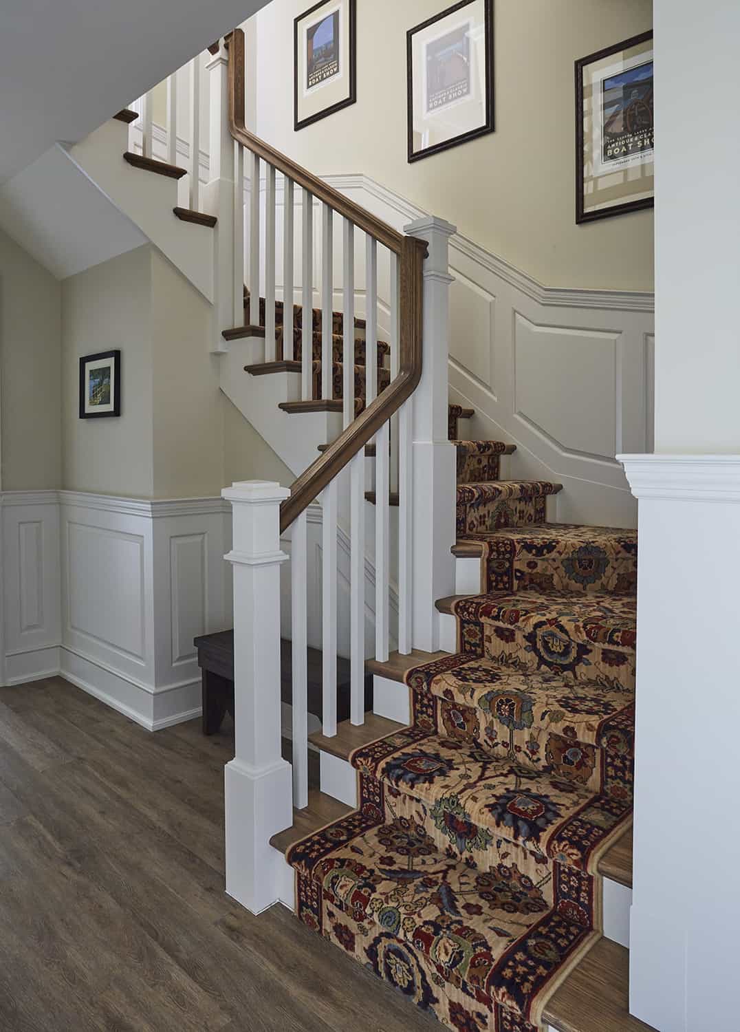 staircase with carpet runner, wood treads, painted baluster