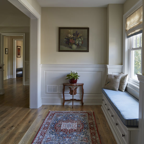 upholstered-window-seat-in-upper-level-landing upper level landing with upholstered window seat