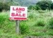 land for sale sign in grass