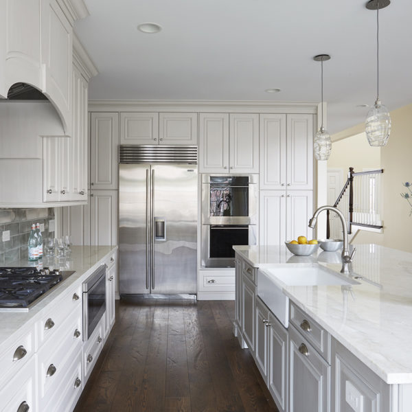 classic white kitchen with built in refrigerator
