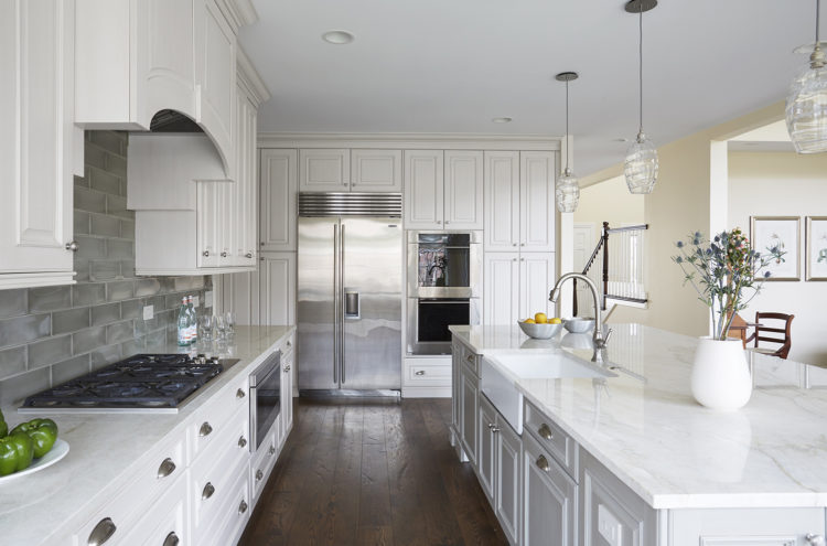 classic white kitchen with built in refrigerator