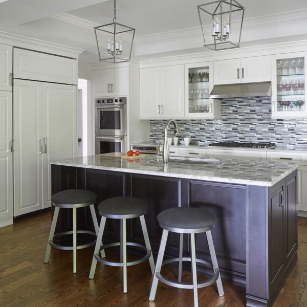 mosaic tile backsplash and dark wood island