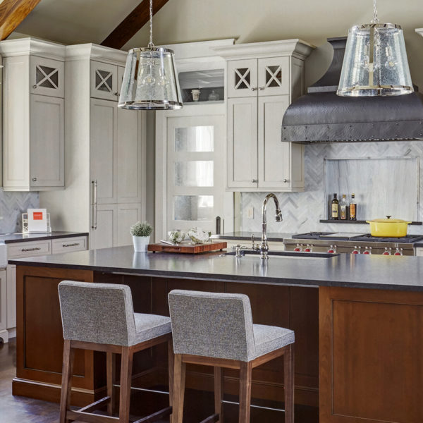 hammered steel range hood in transitional kitchen
