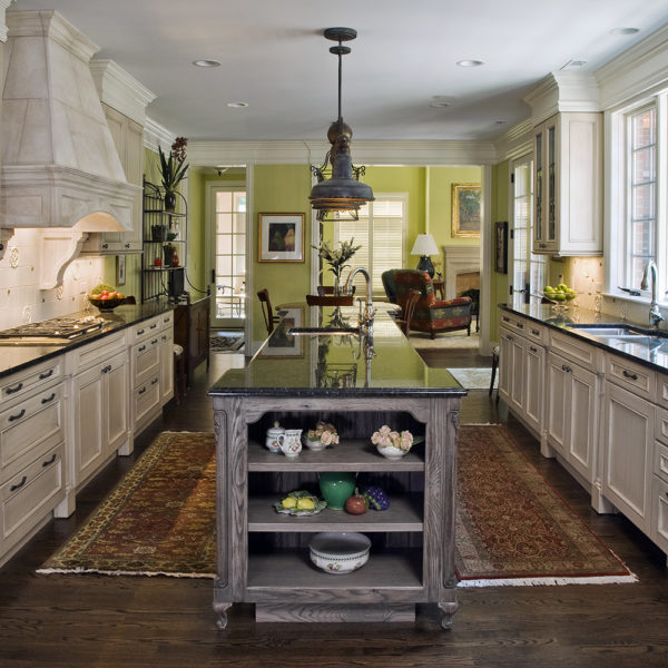 traditional kitchen with open end display shelves on island