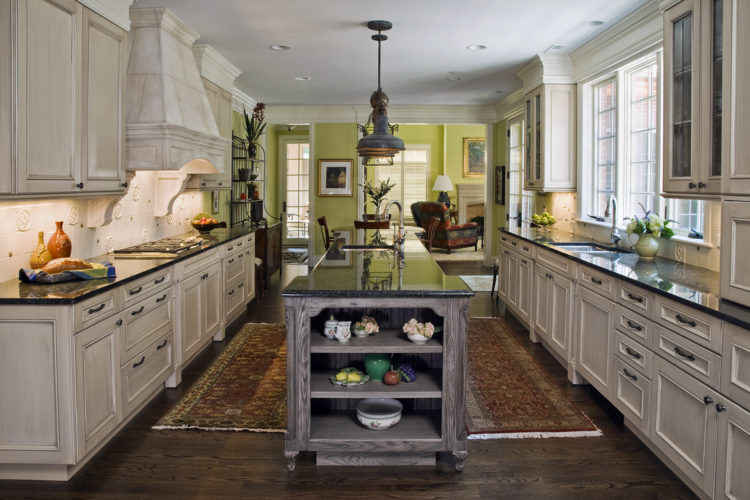 traditional kitchen with open end display shelves on island