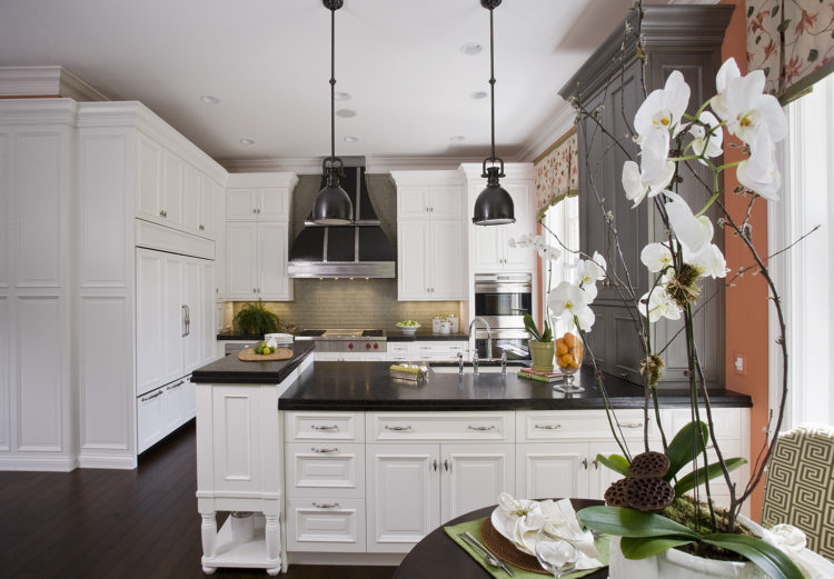 white cabinets and orange wall